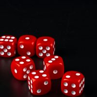 Group of dice close up on dark black background